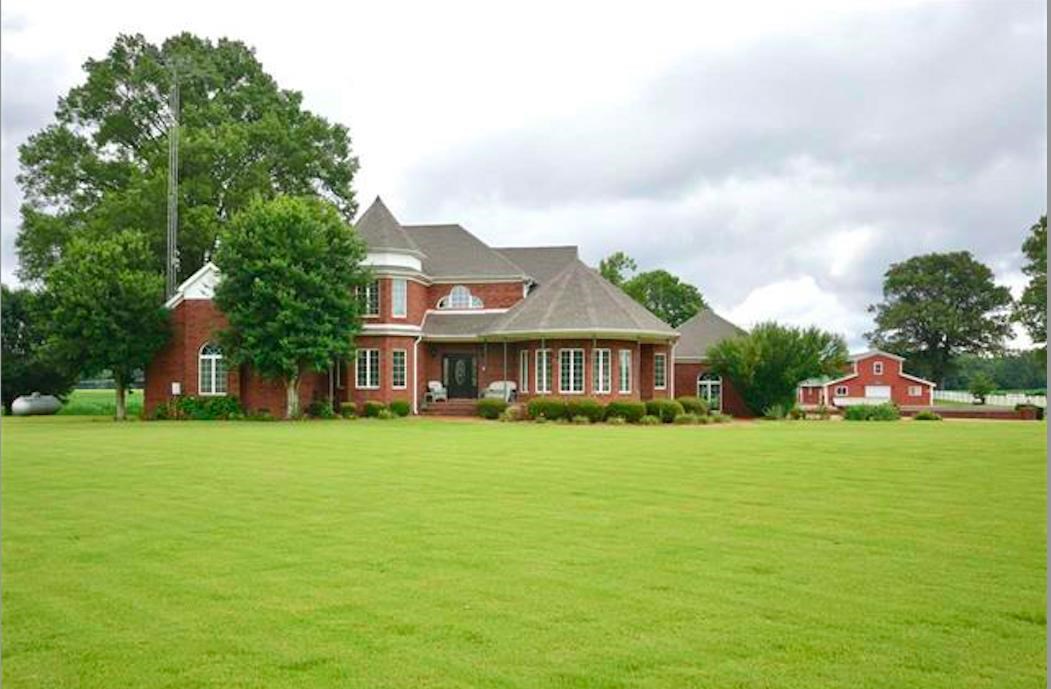 315 Hill House Road Toone, TN 38381 - Photo 2 of 23 a view of a house with a big yard