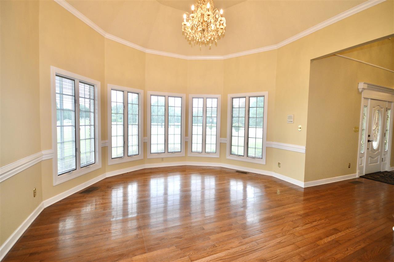 315 Hill House Road Toone, TN 38381 - Photo 13 of 23 a view of an empty room with wooden floor and a window