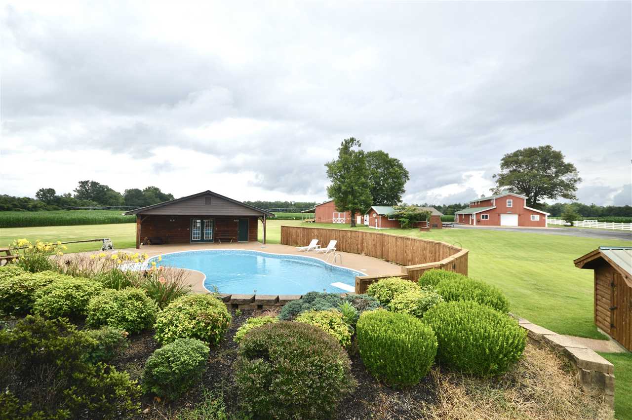 315 Hill House Road Toone, TN 38381 - Photo 9 of 23 a view of a house with pool and a yard