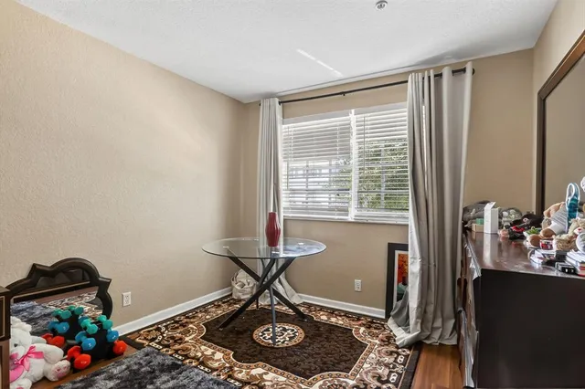 a room with furniture and floor to ceiling window