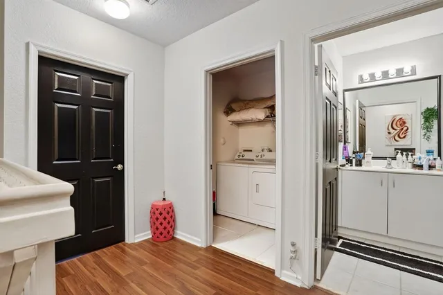 a bedroom with a bed and a mirror