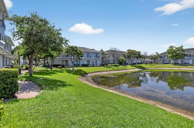 a view of a lake with a yard