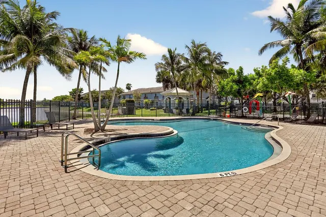 a view of a swimming pool with a slide