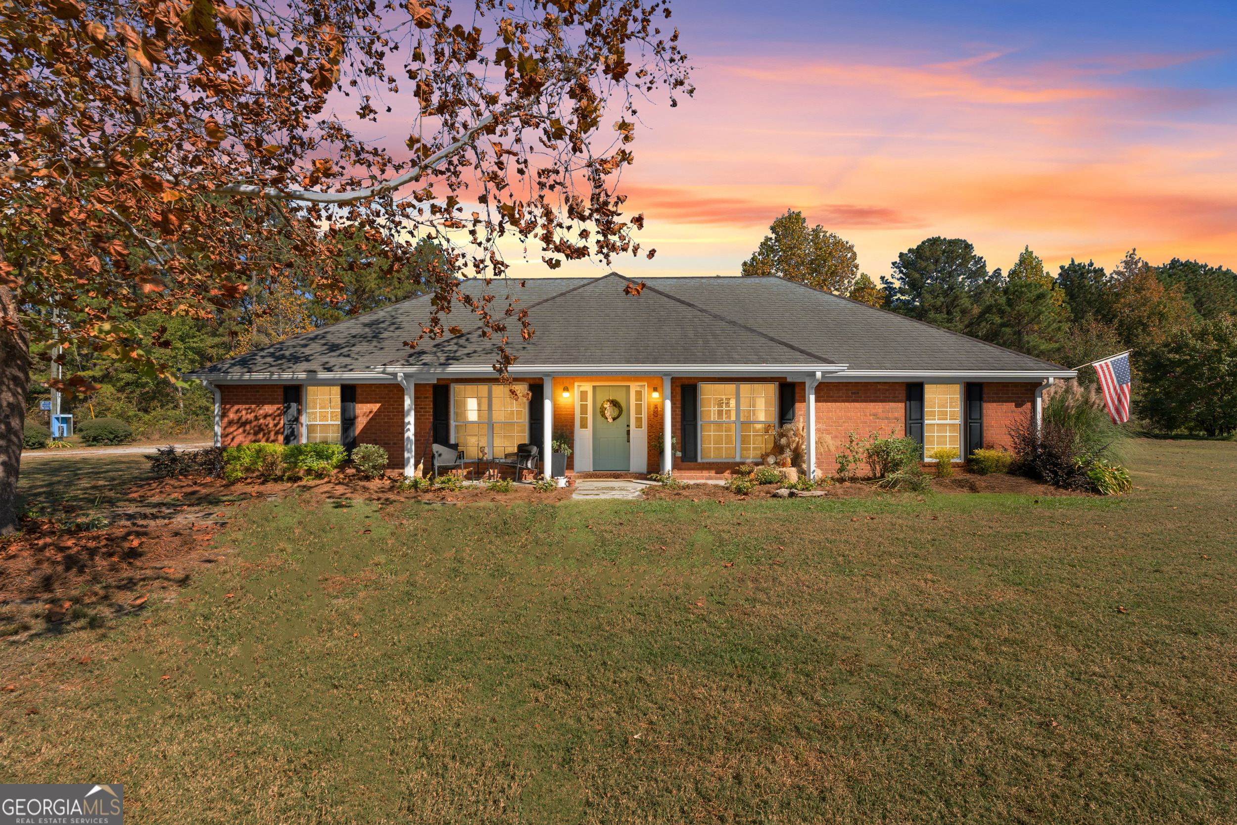 a front view of a house with garden