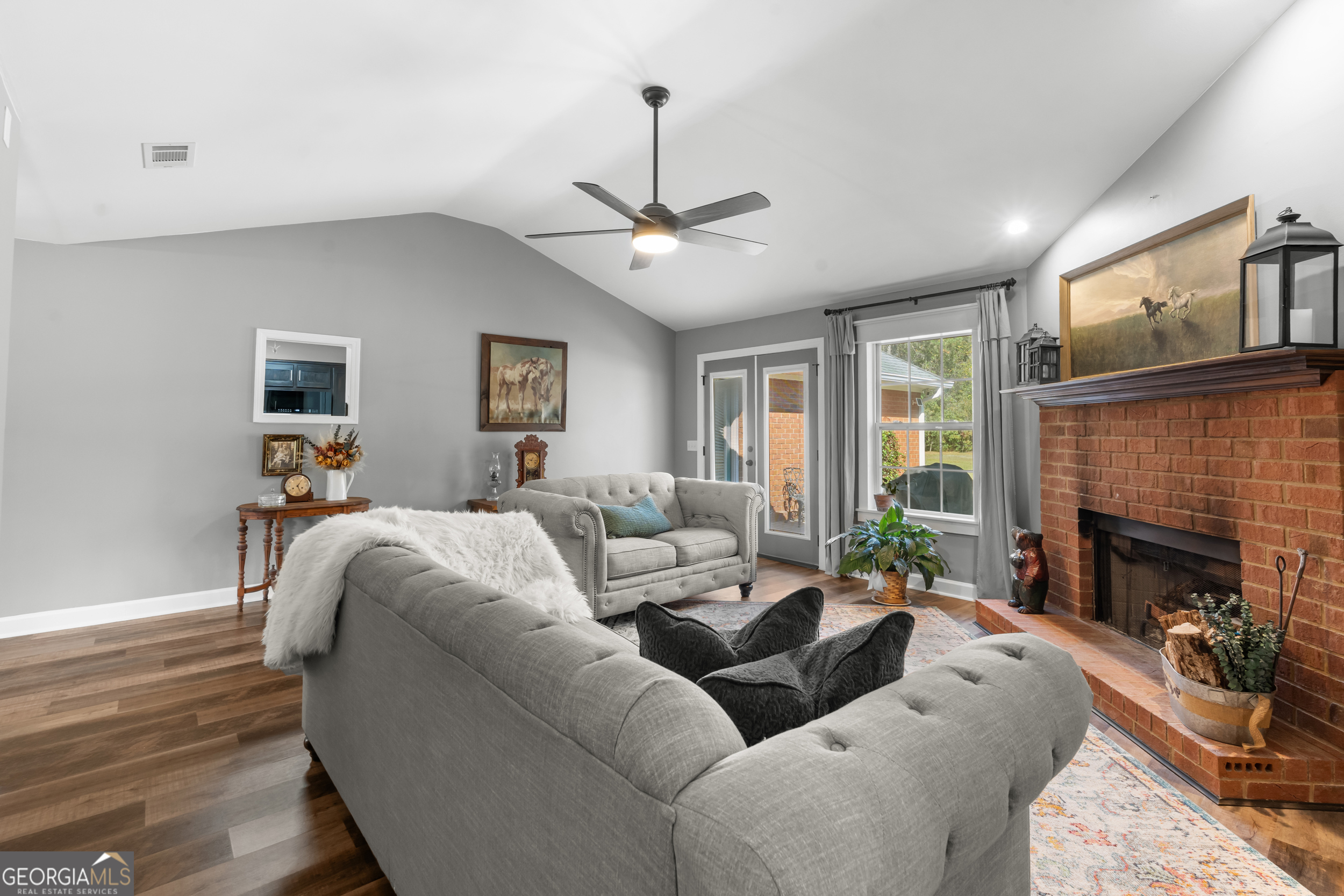 357 Pound Road Guyton, GA 31312 - Photo 11 of 49 a living room with furniture fireplace and flat screen tv