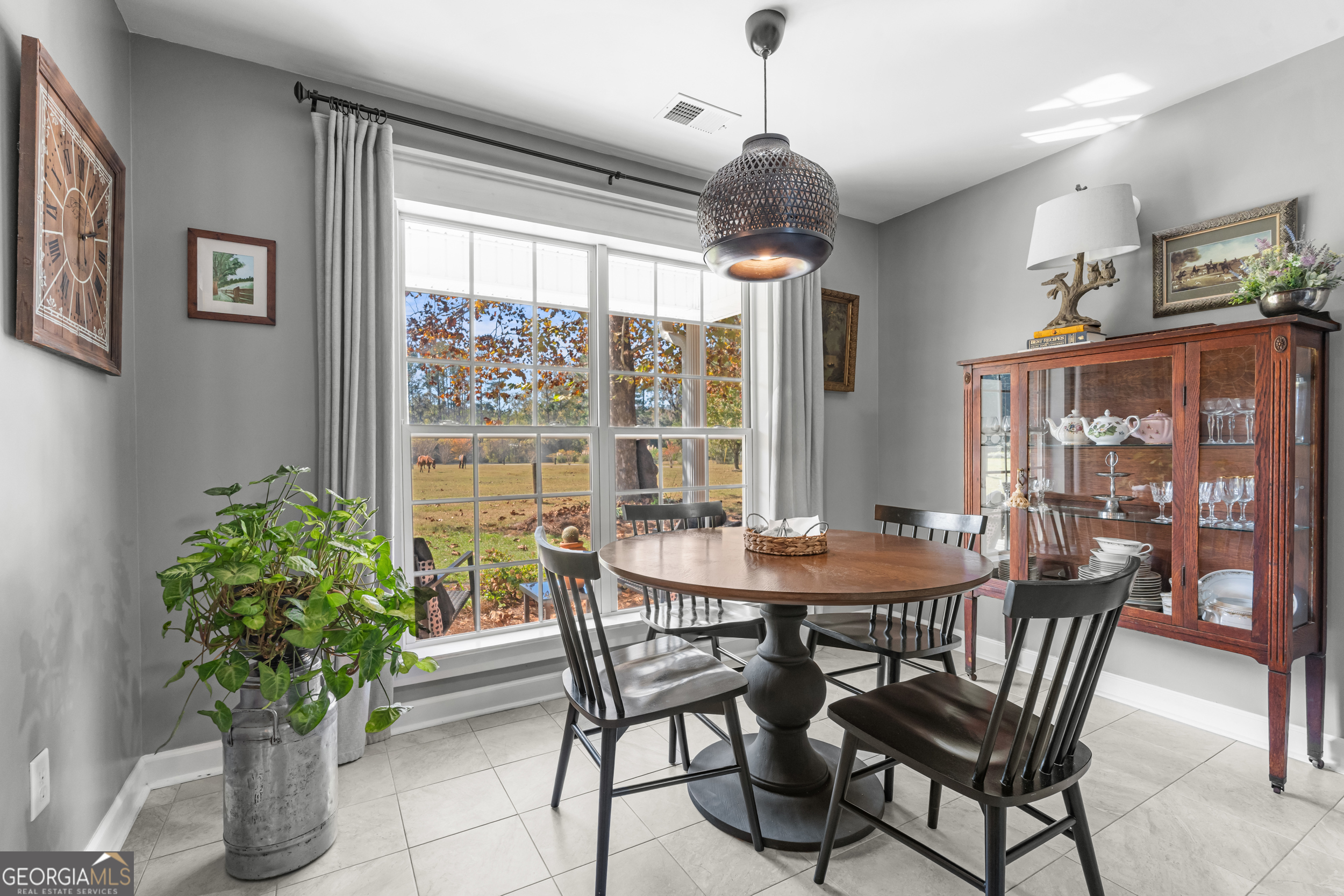 357 Pound Road Guyton, GA 31312 - Photo 12 of 49 a view of a dining room with furniture window and outside view