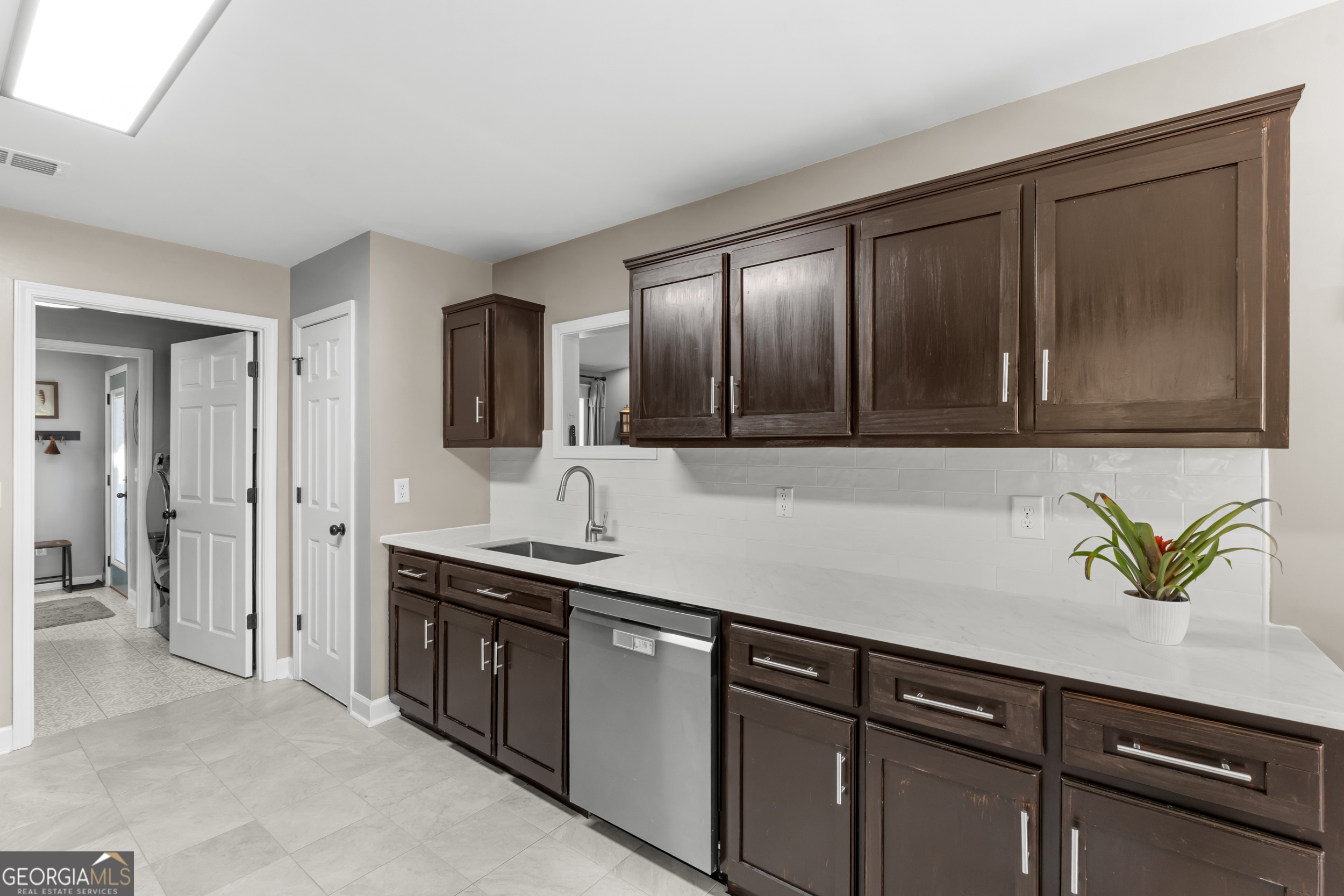 357 Pound Road Guyton, GA 31312 - Photo 14 of 49 a sink with stainless steel appliances granite countertop cabinets and window