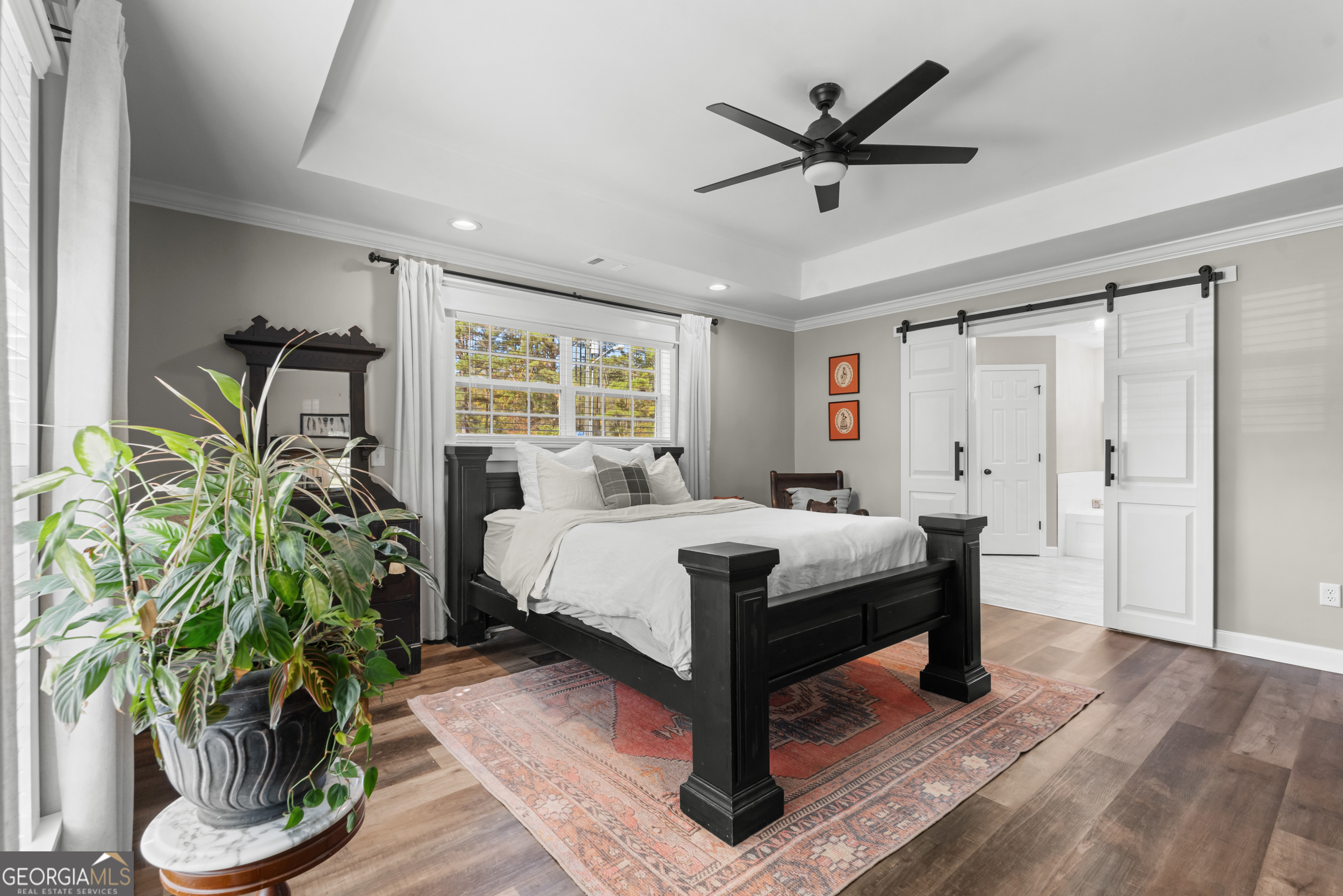 357 Pound Road Guyton, GA 31312 - Photo 16 of 49 a bed sitting in a spacious bedroom next to a window