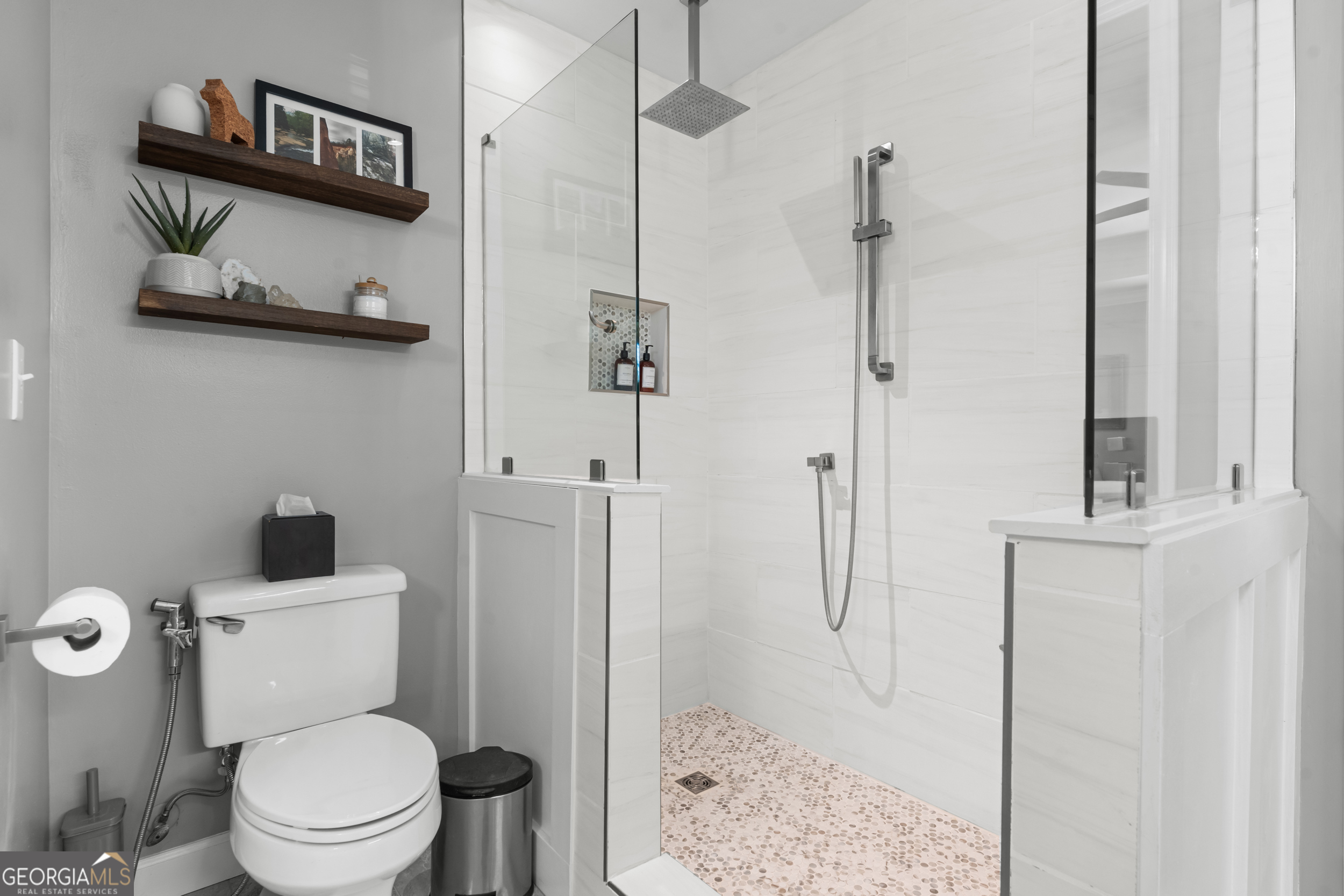 357 Pound Road Guyton, GA 31312 - Photo 18 of 49 a white toilet sitting next to a bathroom sink