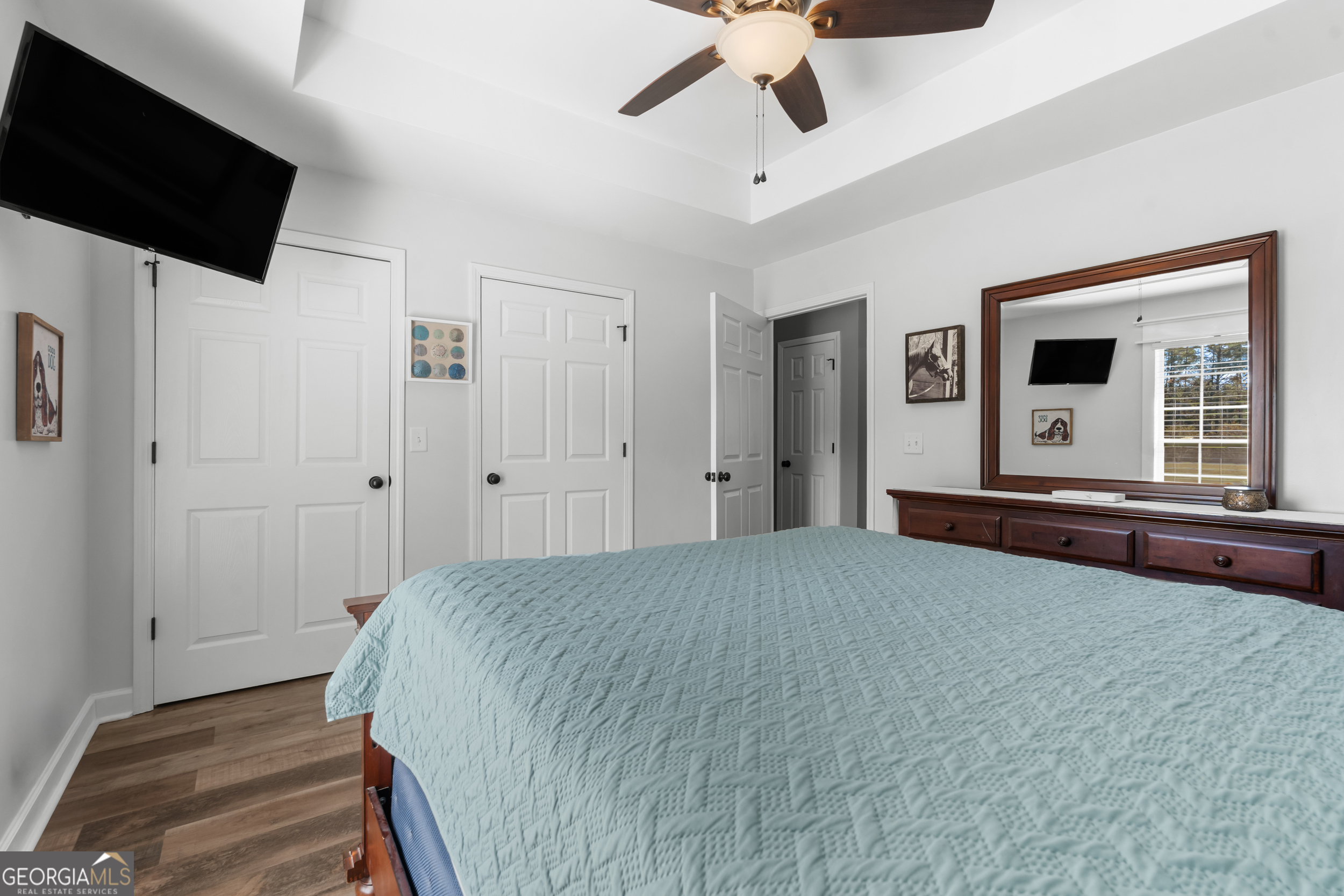 357 Pound Road Guyton, GA 31312 - Photo 22 of 49 a spacious bedroom with a bed and a flat screen tv