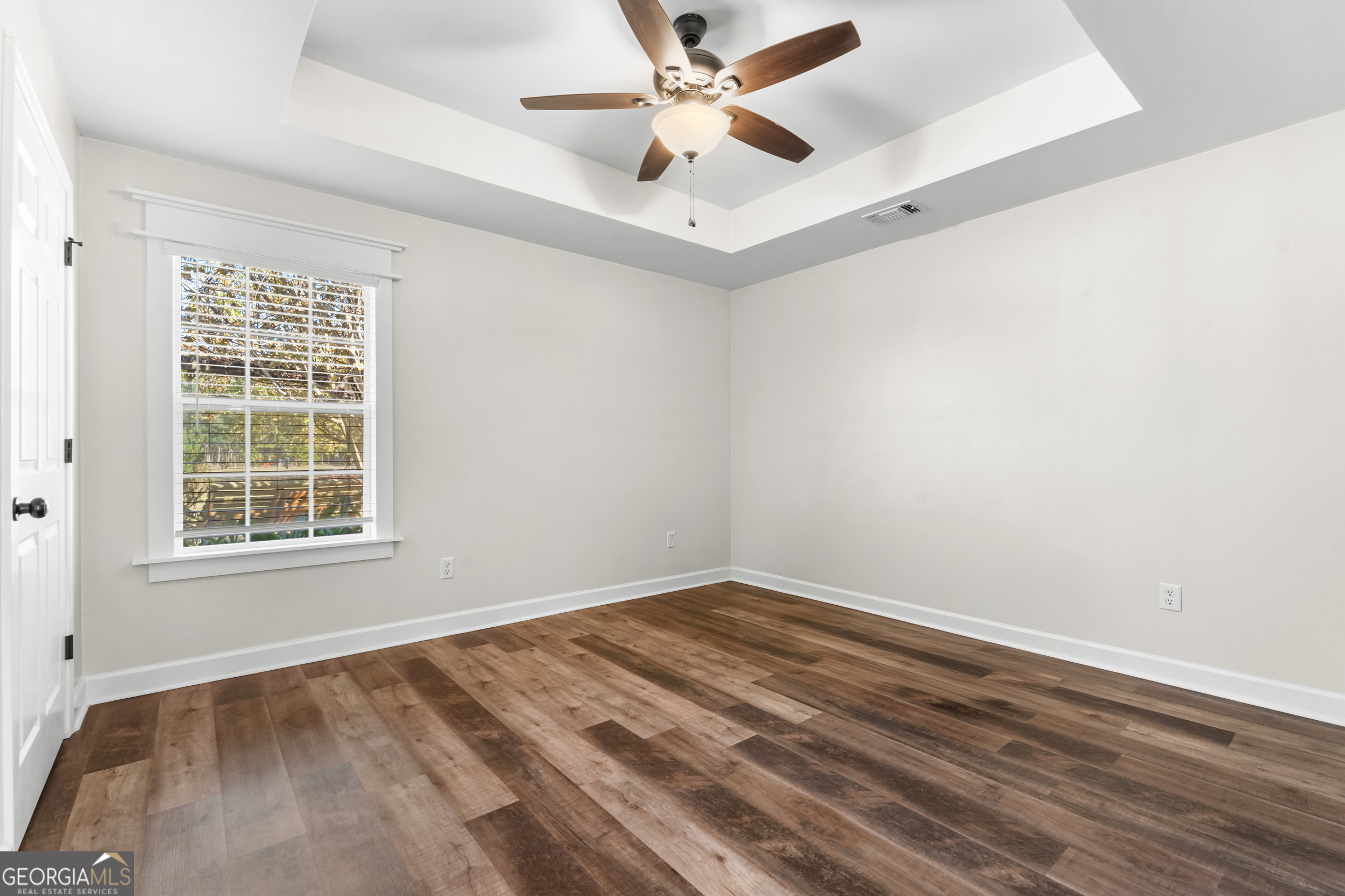 357 Pound Road Guyton, GA 31312 - Photo 24 of 49 an empty room with a window and a ceiling fan