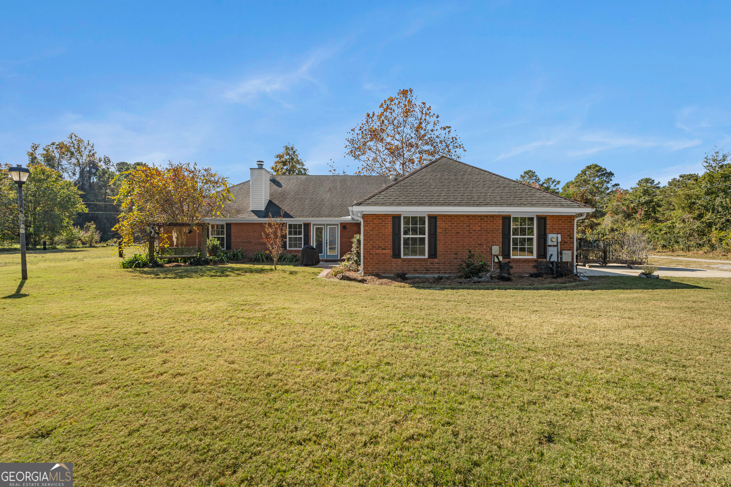 357 Pound Road Guyton, GA 31312 - Photo 28 of 49 a front view of a house with a garden