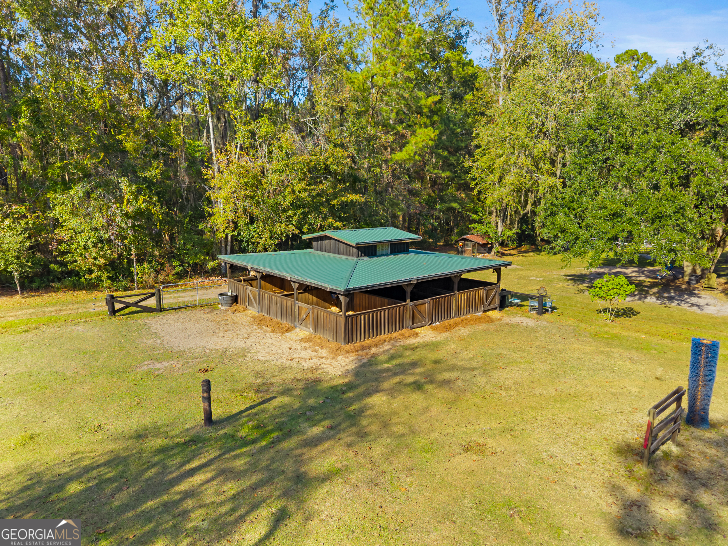 357 Pound Road Guyton, GA 31312 - Photo 29 of 49 a swimming pool with some trees in the background