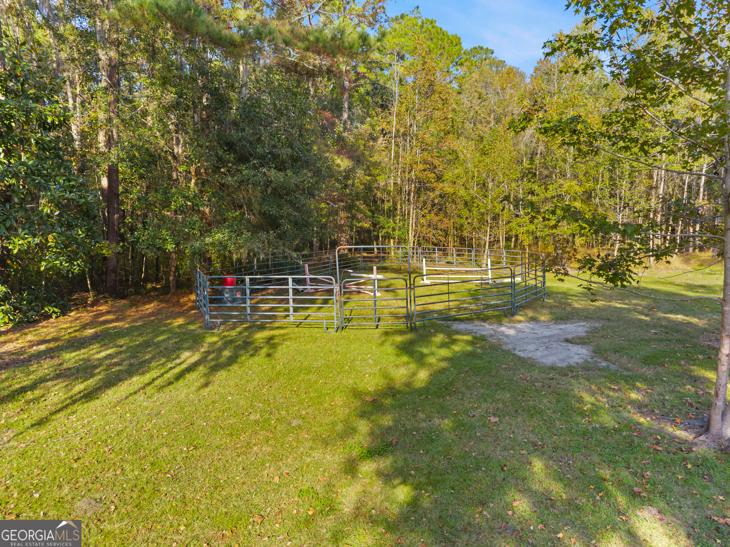 357 Pound Road Guyton, GA 31312 - Photo 35 of 49 a view of a swimming pool with an outdoor space and seating area