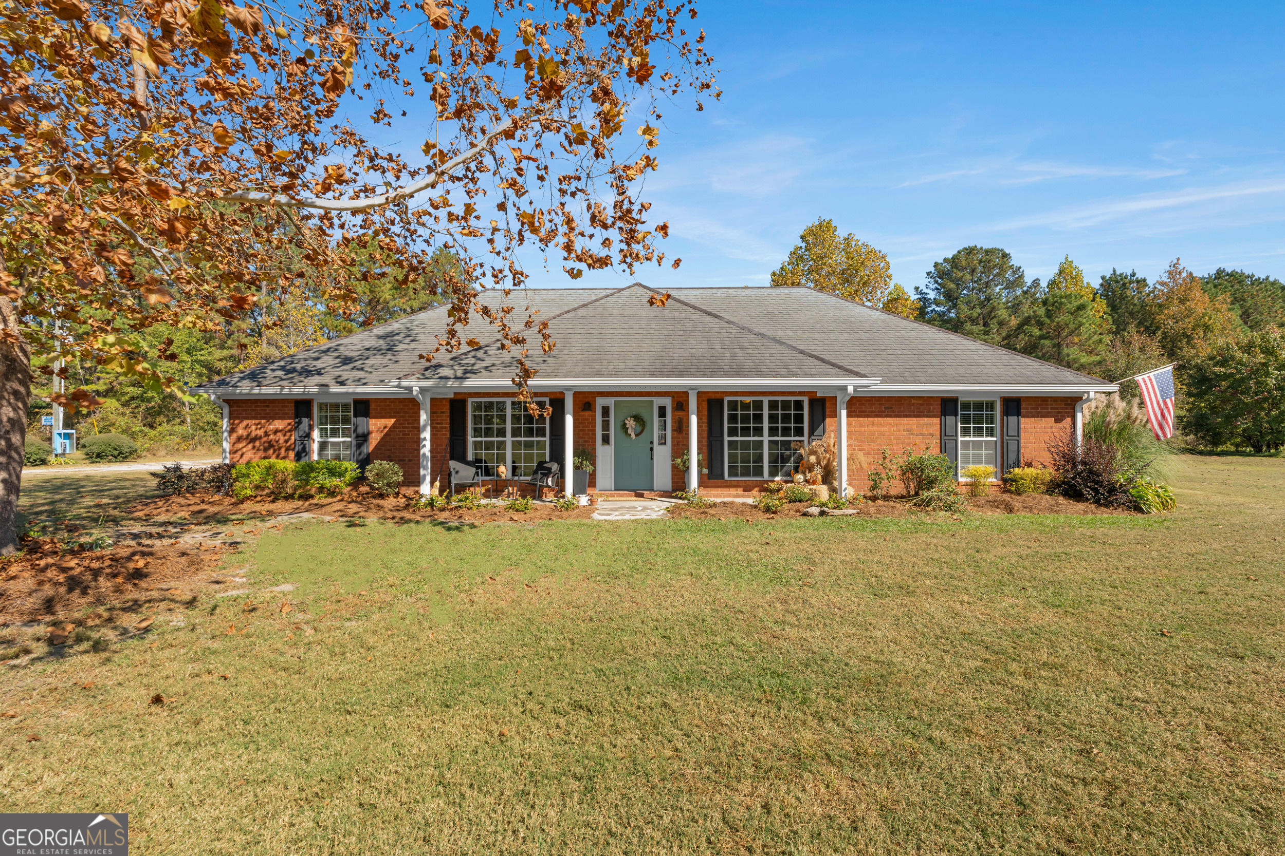 357 Pound Road Guyton, GA 31312 - Photo 4 of 49 a front view of a house with swimming pool having outdoor seating