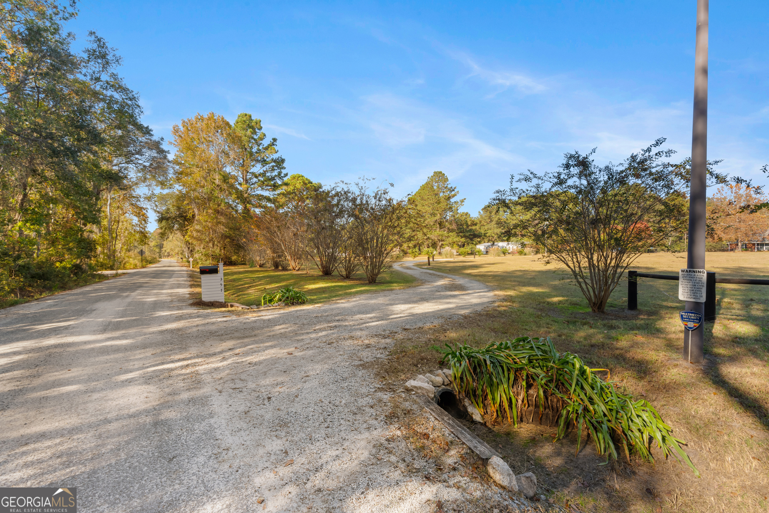 357 Pound Road Guyton, GA 31312 - Photo 48 of 49 a view of a yard with an tree