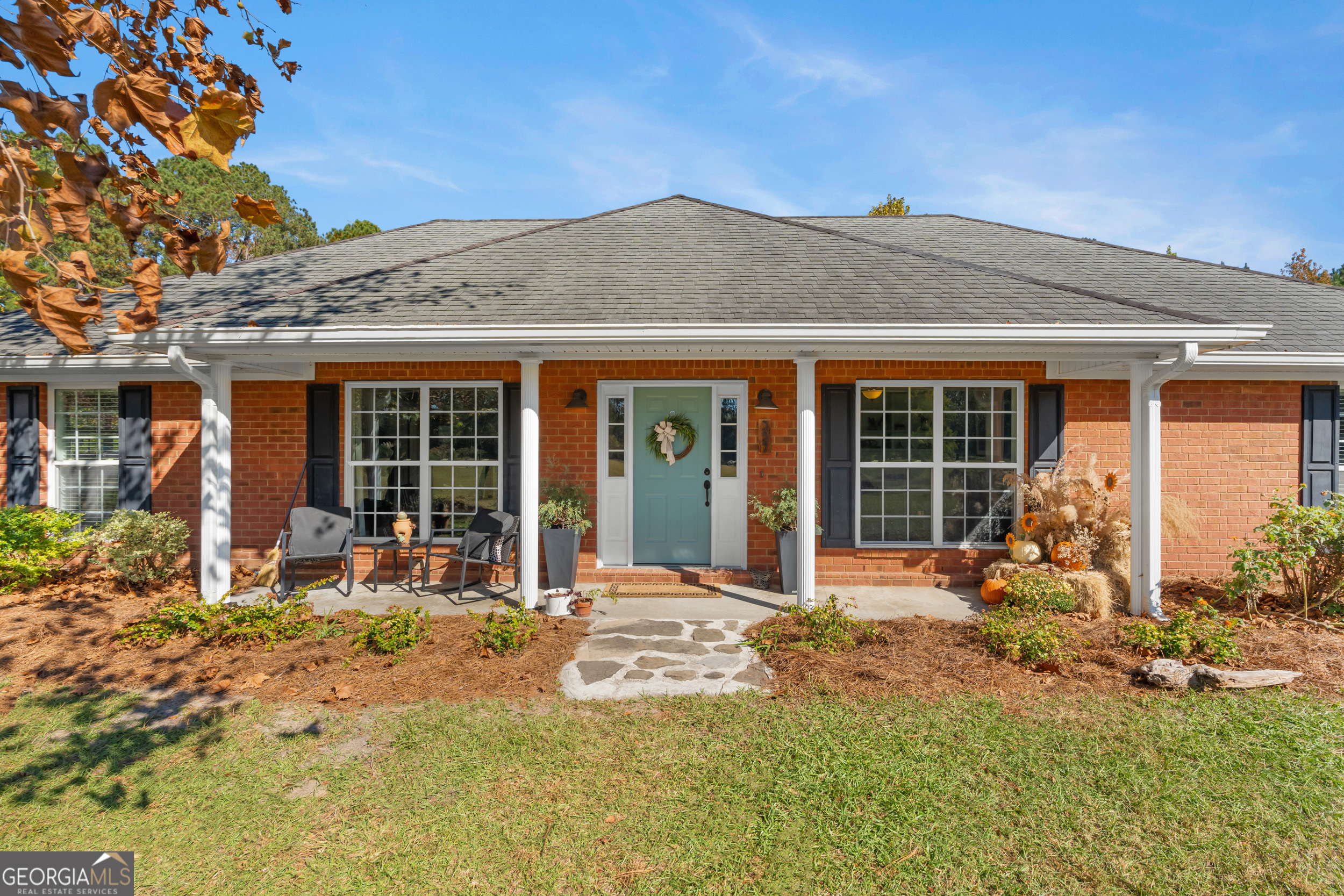 357 Pound Road Guyton, GA 31312 - Photo 5 of 49 a front view of a house with patio