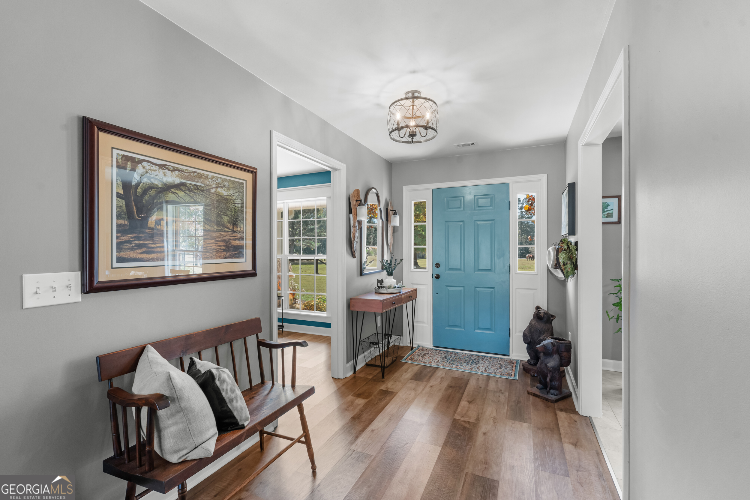 357 Pound Road Guyton, GA 31312 - Photo 6 of 49 a view of a hallway with furniture and windows