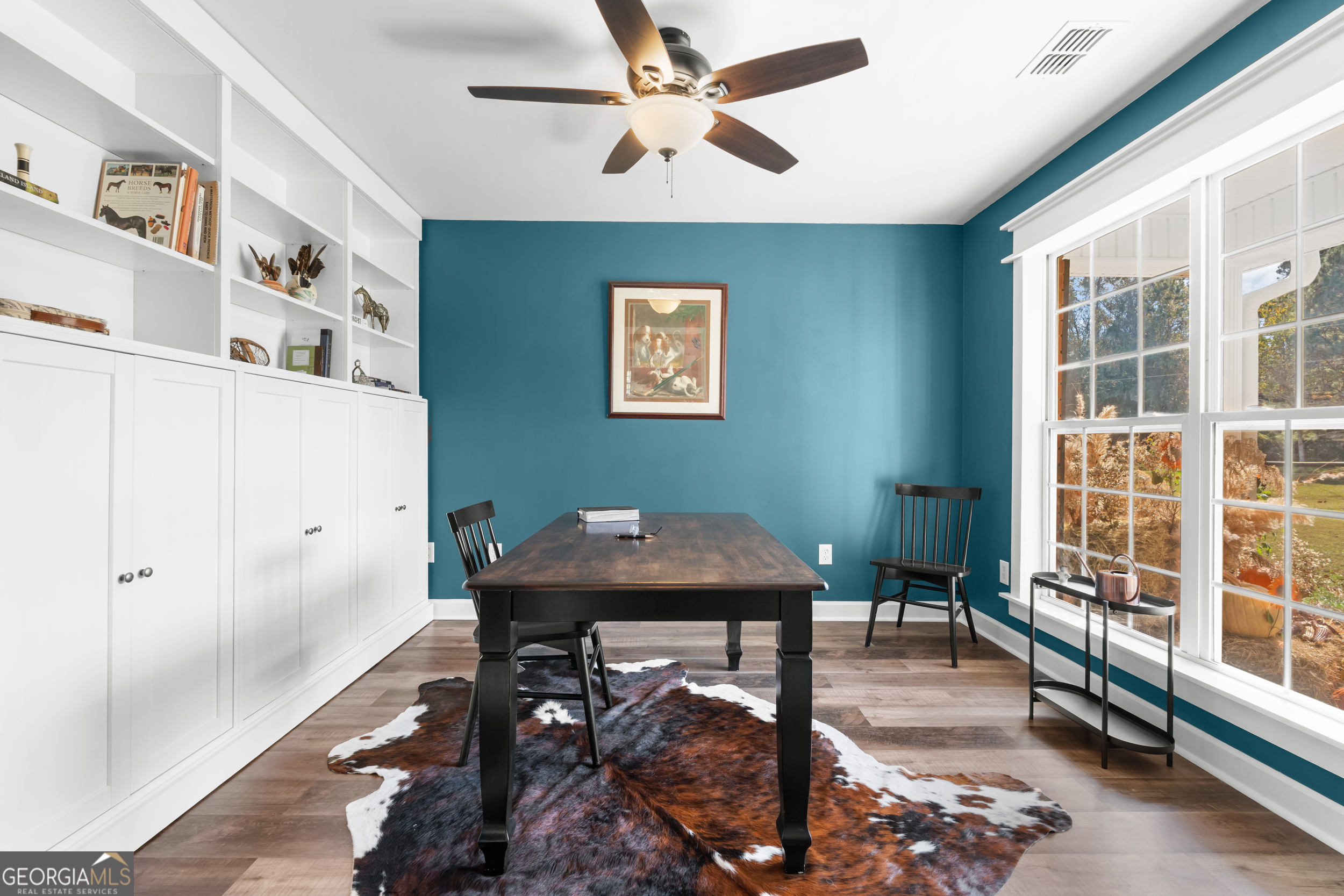 357 Pound Road Guyton, GA 31312 - Photo 7 of 49 a view of a workspace with furniture and a window