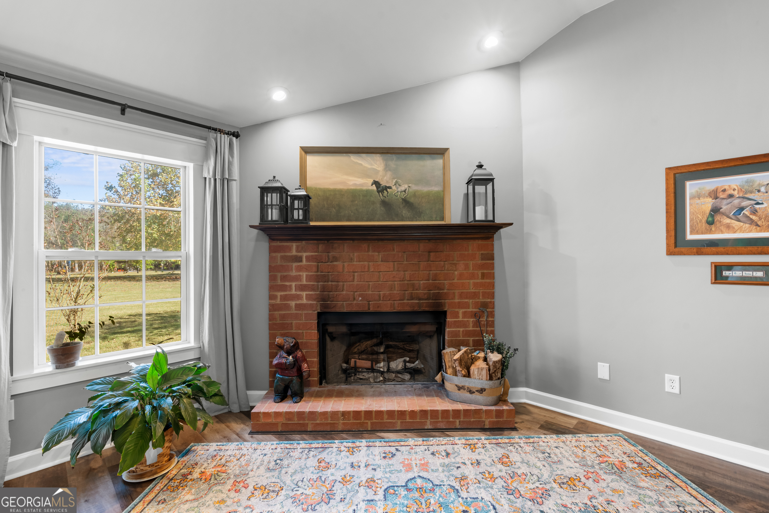 357 Pound Road Guyton, GA 31312 - Photo 10 of 49 a living room with furniture and a fireplace