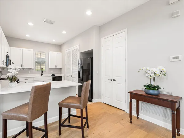a view of kitchen with dining table and chairs