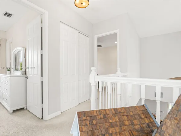 a view of a hallway with windows