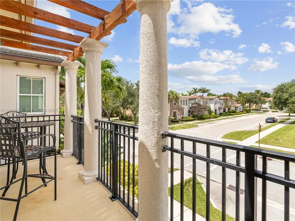 a view of a balcony with furniture