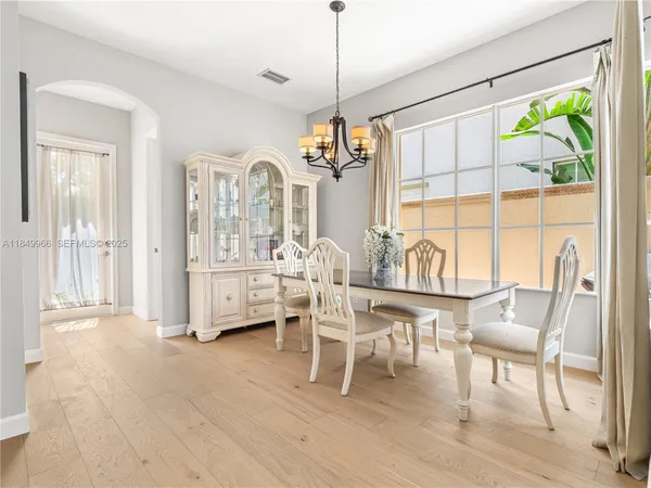 a dining room with furniture and window