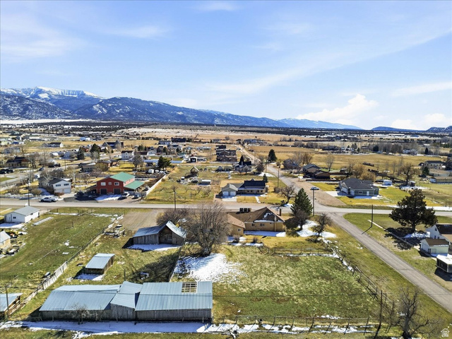 217 East 400 South Spring City, UT 84662 - Photo 68 of 71 Aerial view of property and surrounding area with nearby suburban area and a mountain backdrop