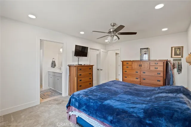 a bed room with a bed and a television