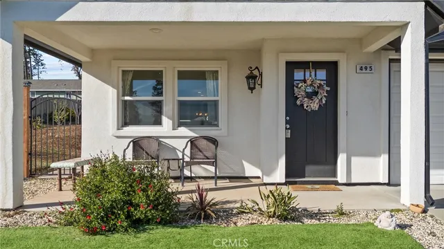 a front view of a house with garden