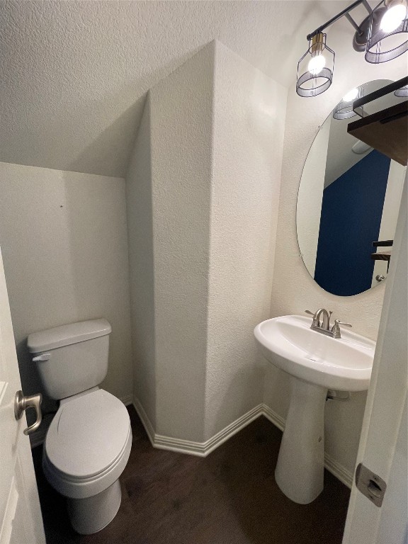 142 Simon Kyle, TX 78640 - Photo 13 of 16 a bathroom with a toilet sink and mirror