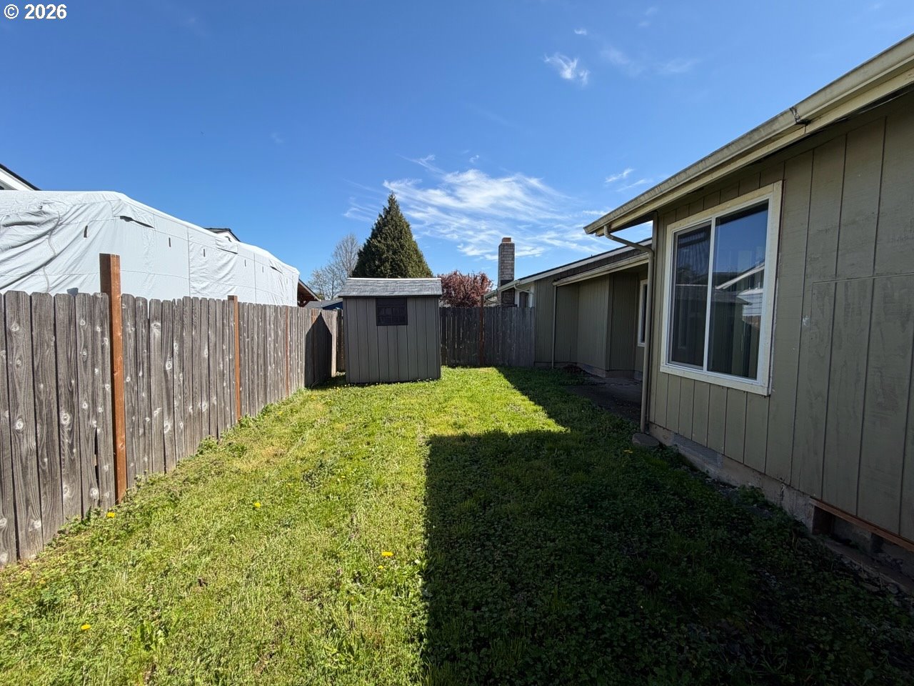 3328 Foxglove Street Lebanon, OR 97355 - Photo 14 of 16 a view of a back yard of the house