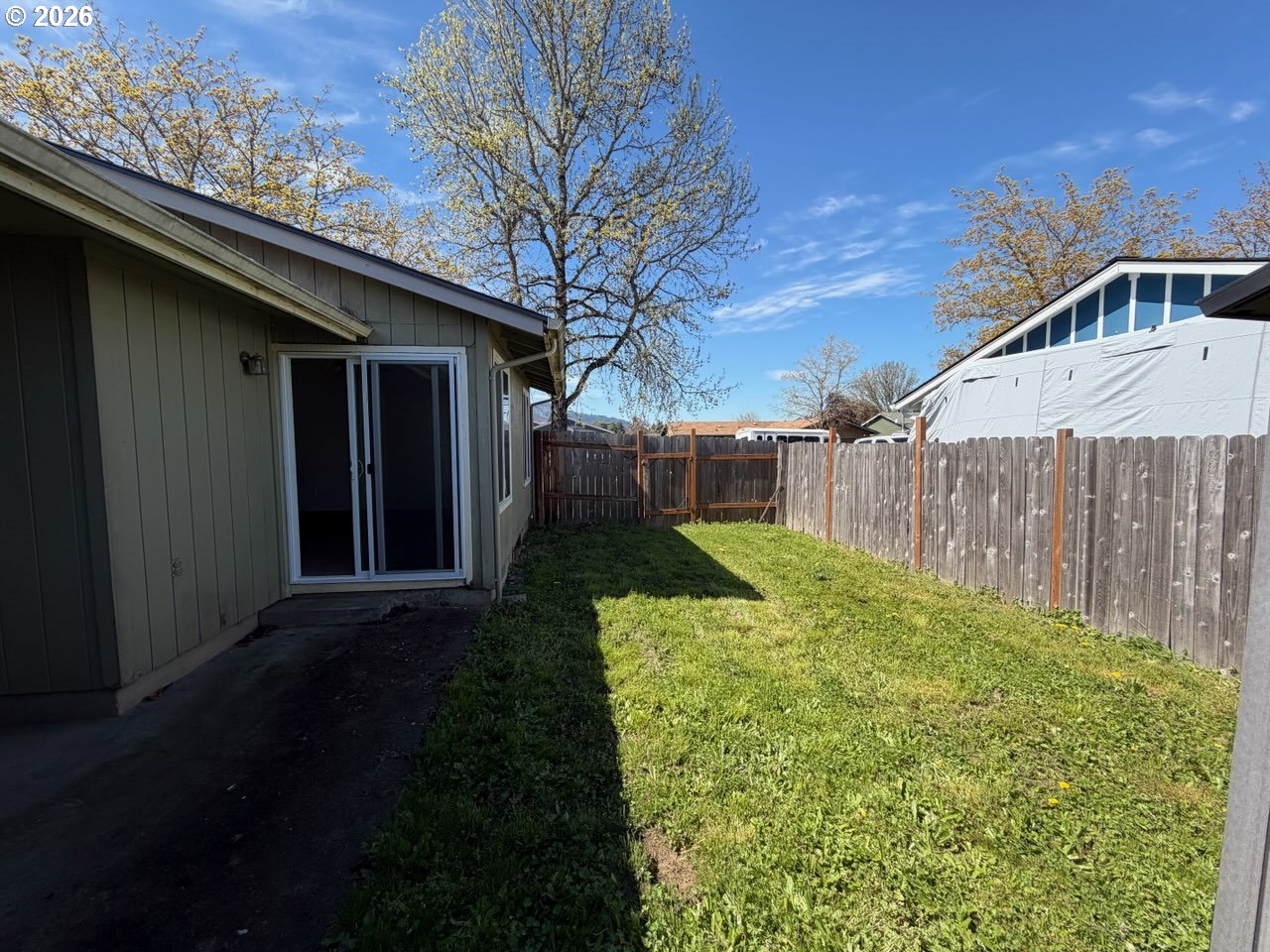 3328 Foxglove Street Lebanon, OR 97355 - Photo 16 of 16 a view of a backyard with plants