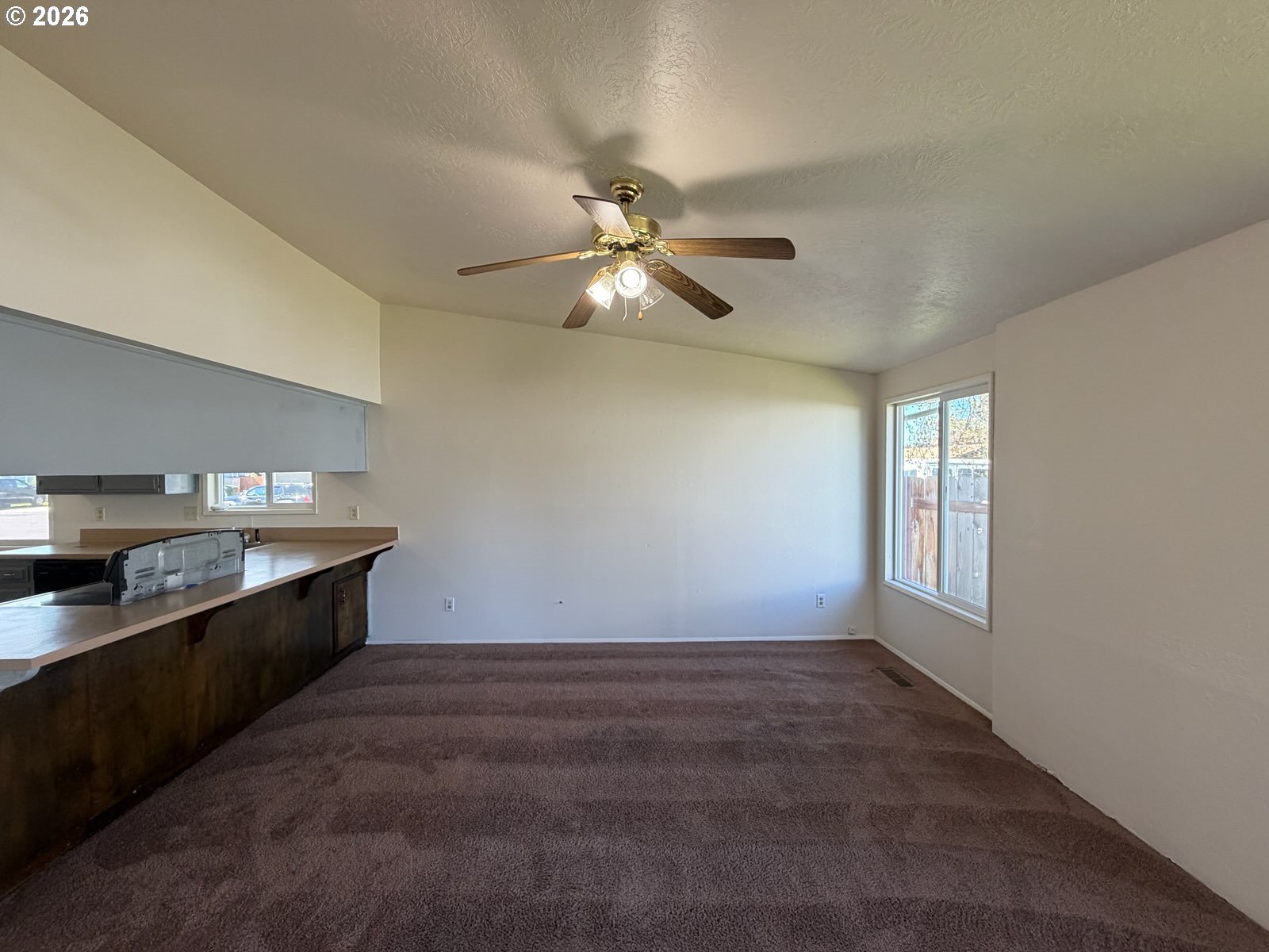 3328 Foxglove Street Lebanon, OR 97355 - Photo 4 of 16 a kitchen with granite countertop a stove a sink and dishwasher