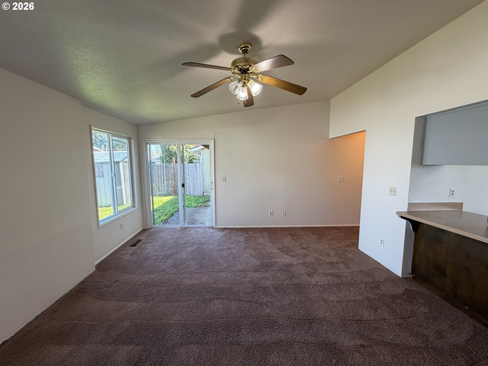 3328 Foxglove Street Lebanon, OR 97355 - Photo 5 of 16 a view of a livingroom with a ceiling fan and window