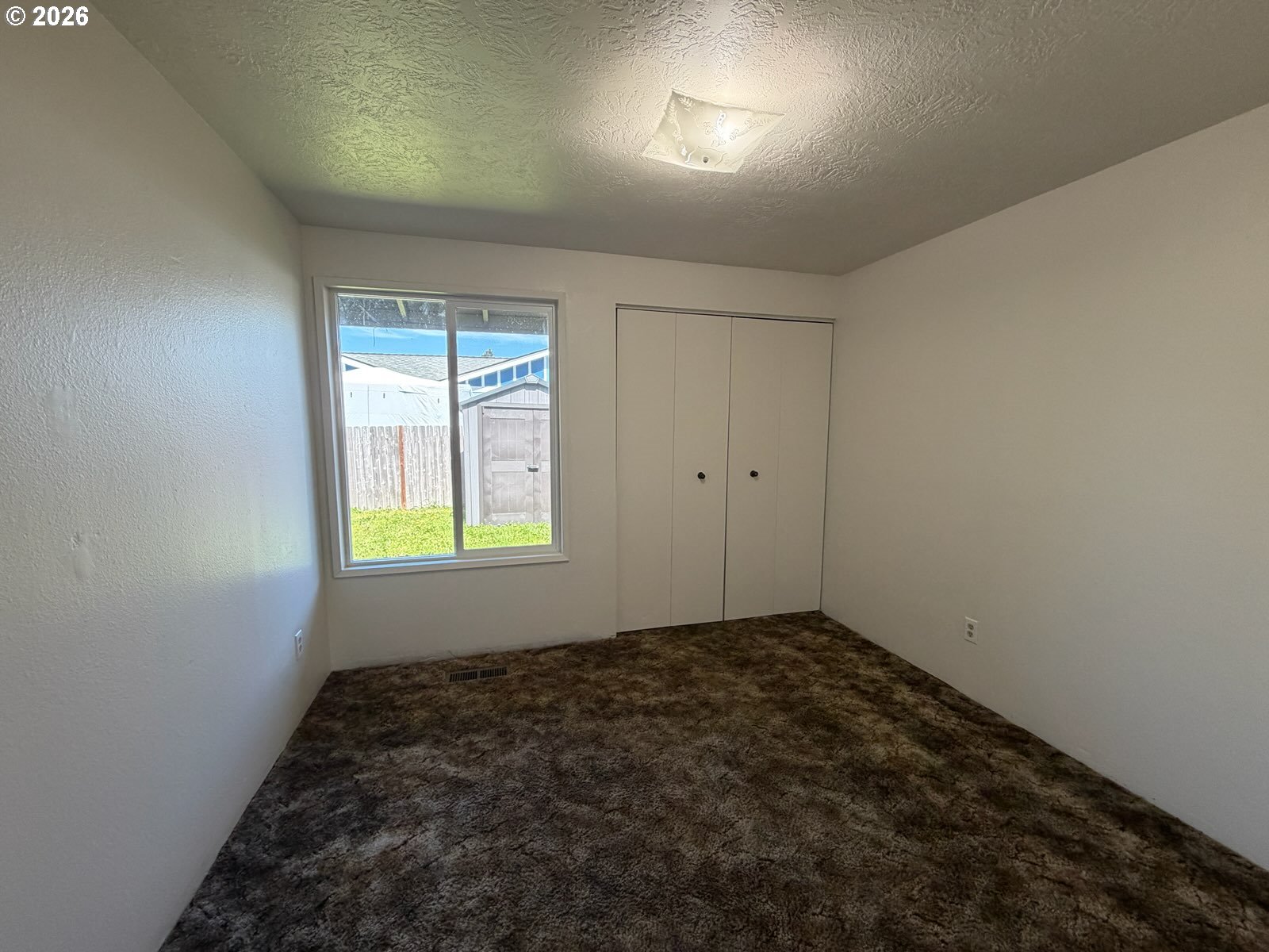 3328 Foxglove Street Lebanon, OR 97355 - Photo 9 of 16 an empty room with windows