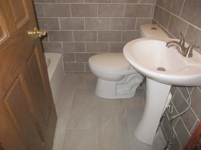 a bathroom with a sink and toilet