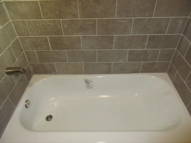 a bathroom with a bath tub