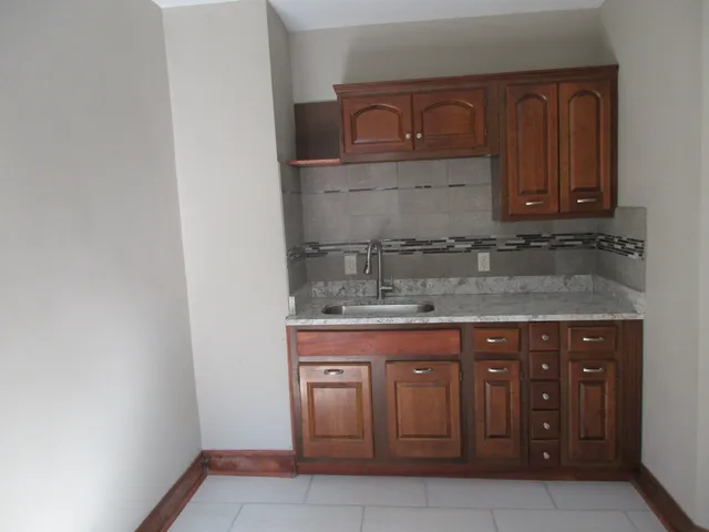 a kitchen with a sink and cabinets