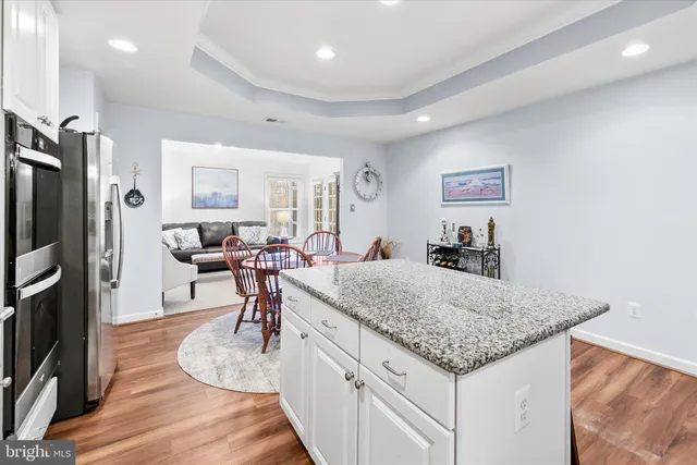 a living room with furniture and a counter top space