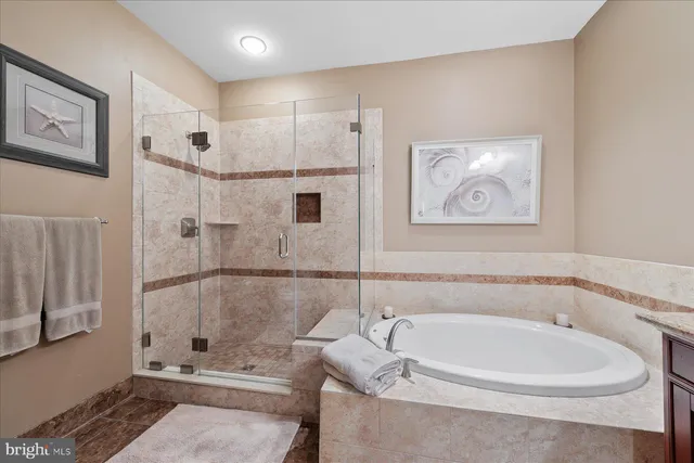 a bathroom with a tub and a shower