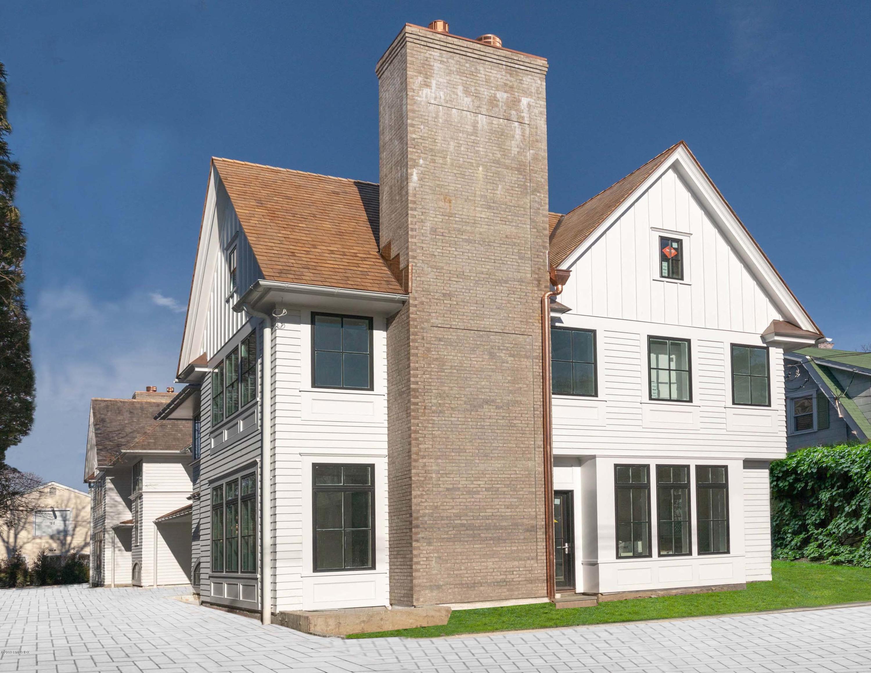 59 East Elm Street, Unit BACK Greenwich, CT 06830 - Photo 1 of 18 a view of front of house with a yard