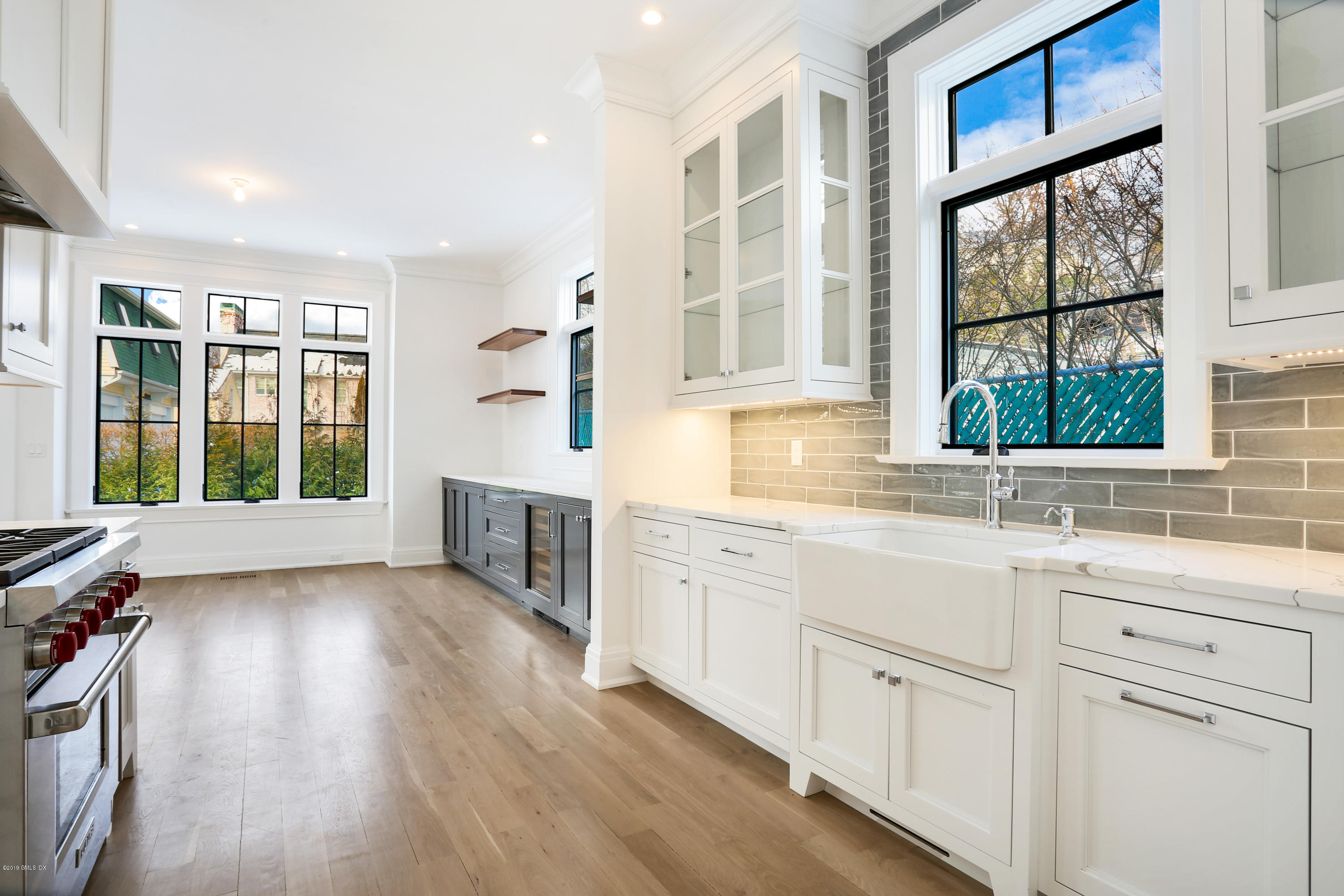 59 East Elm Street, Unit BACK Greenwich, CT 06830 - Photo 4 of 18 a kitchen with a sink windows and a refrigerator