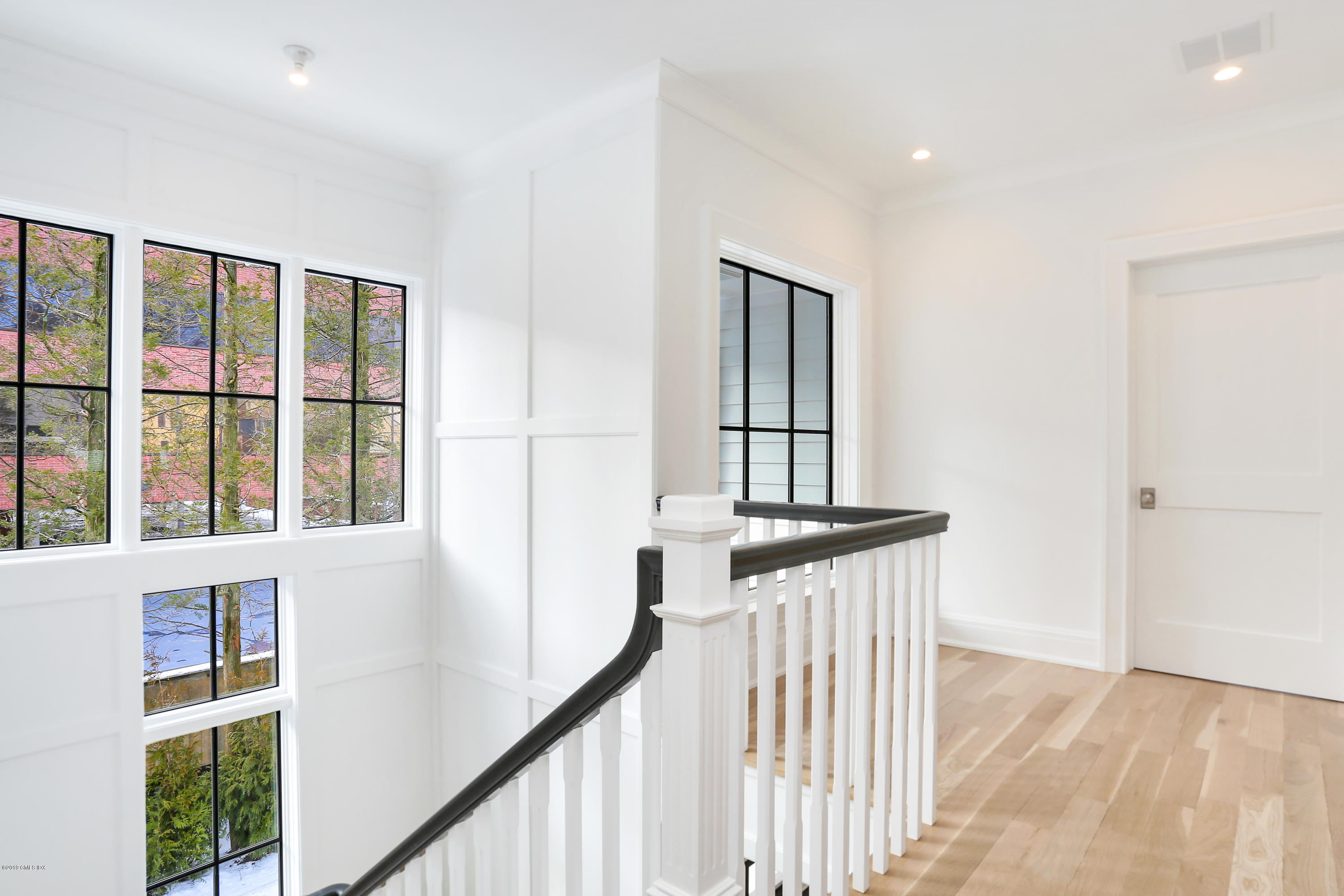 59 East Elm Street, Unit BACK Greenwich, CT 06830 - Photo 9 of 18 a view of a hallway with windows
