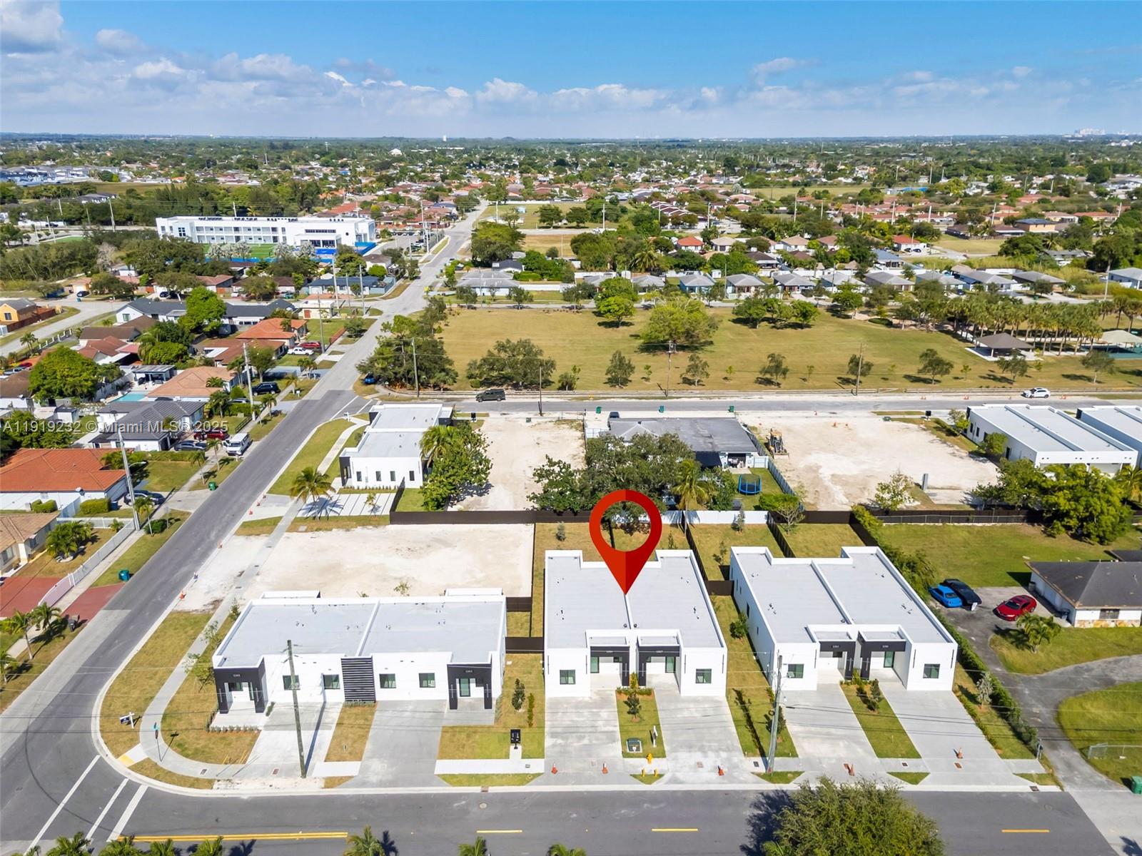 12389 Southwest 220th Street Miami, FL 33170 - Photo 20 of 20 an aerial view of residential houses with outdoor space