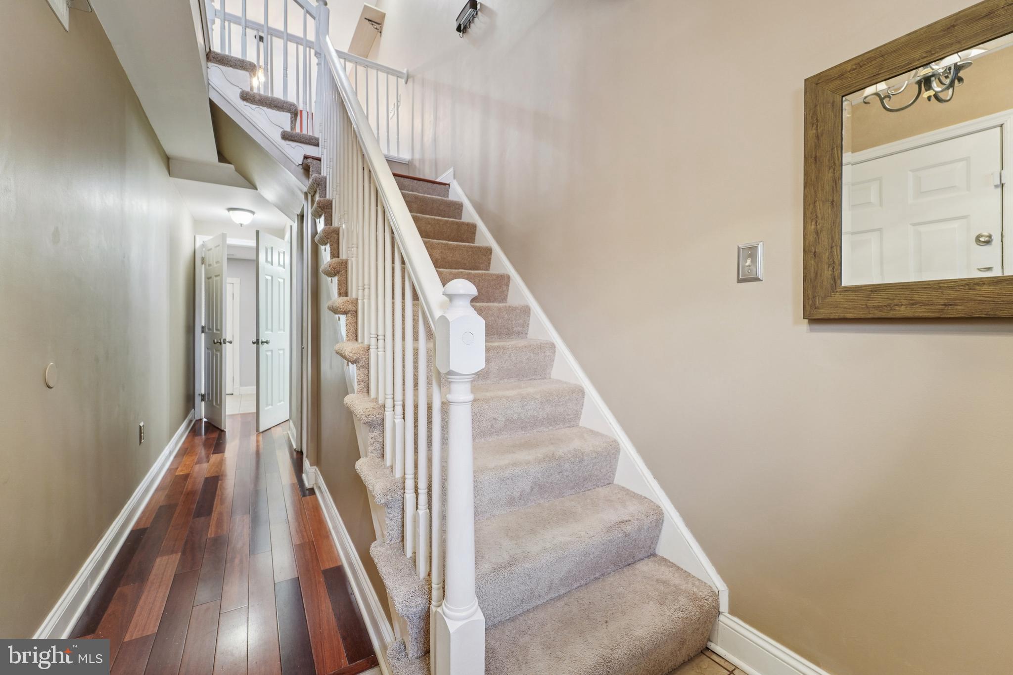 56 Victoria Square Frederick, MD 21702 - Photo 8 of 38 a view of a hallway with wooden floor and entryway
