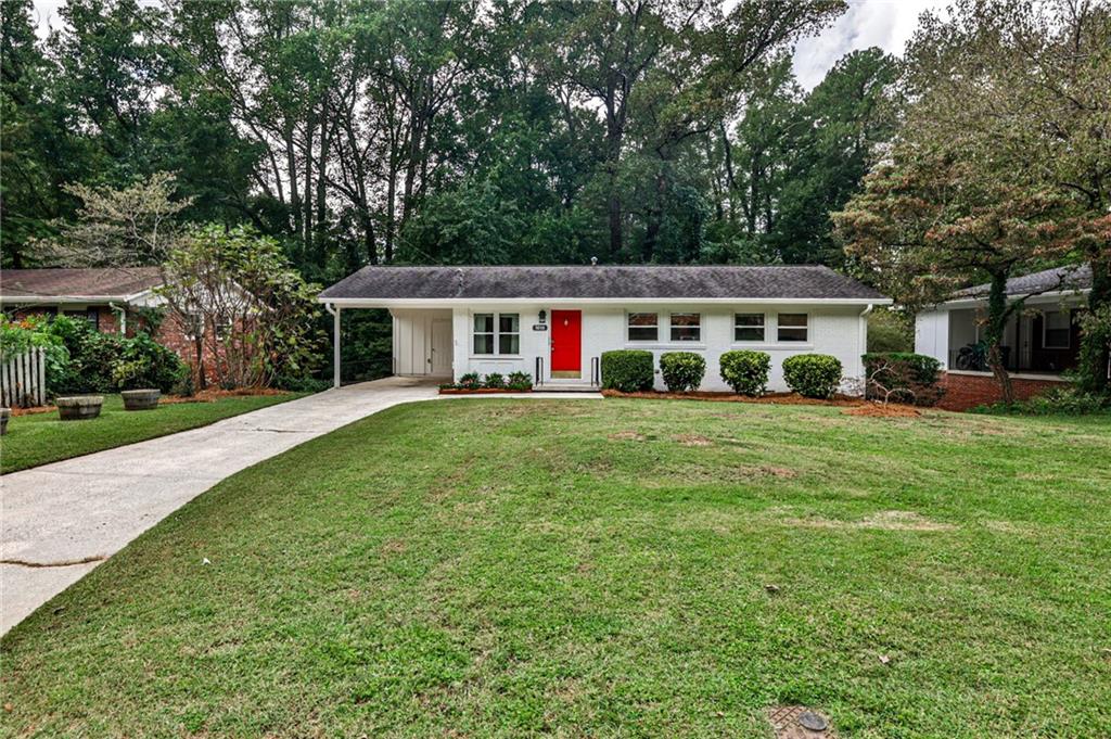 1010 Greenbriar Circle Decatur, GA 30033 - Photo 1 of 28 a view of house with a big yard and large trees