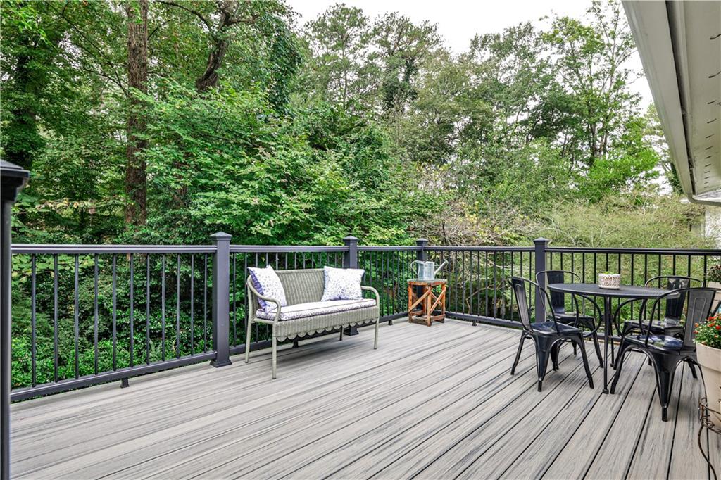 1010 Greenbriar Circle Decatur, GA 30033 - Photo 17 of 28 a view of a balcony with chairs and wooden floor