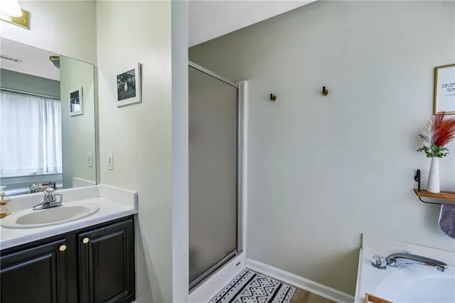 a bathroom with a sink a toilet and vanity